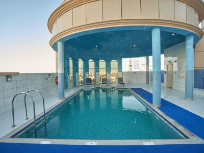 outdoor pool - hotel time express hotel sharjah - sharjah, united arab emirates