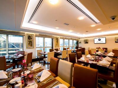 restaurant - hotel majlis grand mercure residence - abu dhabi, united arab emirates