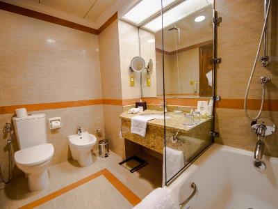 bathroom - hotel majlis grand mercure residence - abu dhabi, united arab emirates