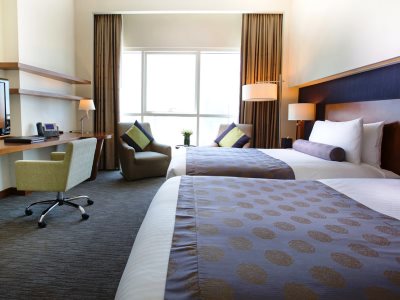 deluxe room - hotel grand millennium al wahda - abu dhabi, united arab emirates