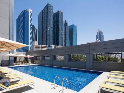 outdoor pool - hotel rove trade centre - dubai, united arab emirates