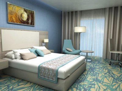 bedroom - hotel mena plaza hotel al barsha - dubai, united arab emirates