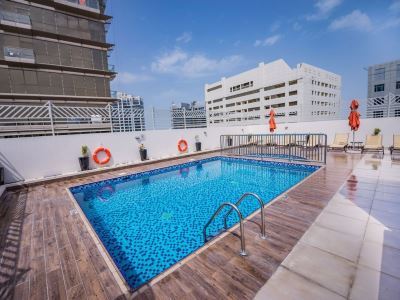 outdoor pool - hotel mena plaza hotel al barsha - dubai, united arab emirates