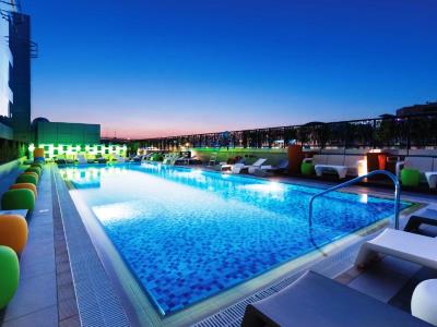 outdoor pool - hotel studio m arabian plaza - dubai, united arab emirates