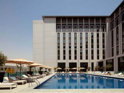 outdoor pool - hotel rove at the park - dubai, united arab emirates