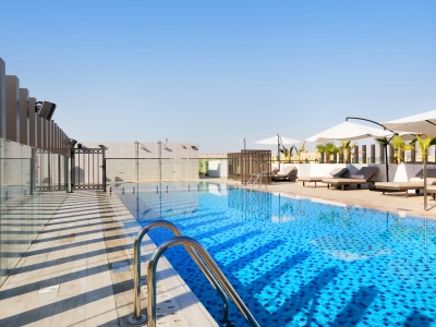 outdoor pool - hotel adagio premium the palm - dubai, united arab emirates
