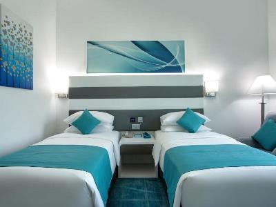 bedroom 1 - hotel city avenue al reqqa - dubai, united arab emirates