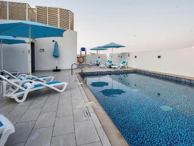 outdoor pool - hotel city avenue al reqqa - dubai, united arab emirates