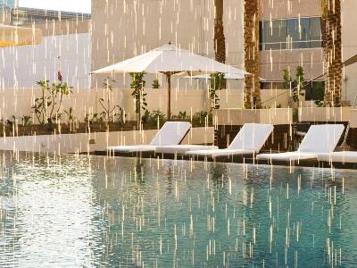 outdoor pool 1 - hotel novotel deira city centre - dubai, united arab emirates