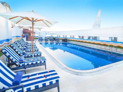 outdoor pool 1 - hotel grand excelsior bur dubai - dubai, united arab emirates