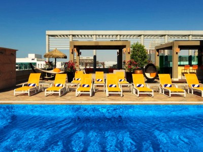 outdoor pool - hotel radisson blu dubai media city - dubai, united arab emirates