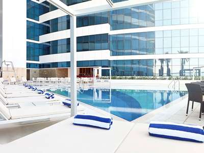 outdoor pool - hotel novotel dubai al barsha - dubai, united arab emirates