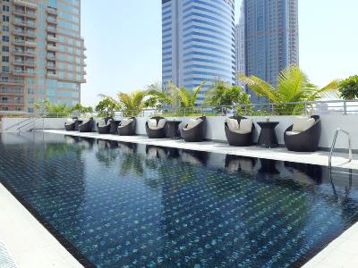 outdoor pool - hotel movenpick jumeirah lake tower - dubai, united arab emirates