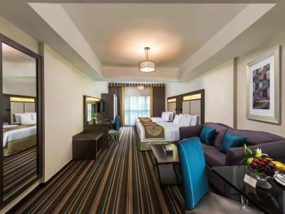 bedroom 1 - hotel savoy central hotel apartments - dubai, united arab emirates