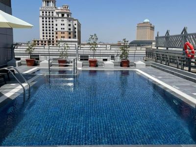 outdoor pool - hotel mena aparthotel al barsha - dubai, united arab emirates