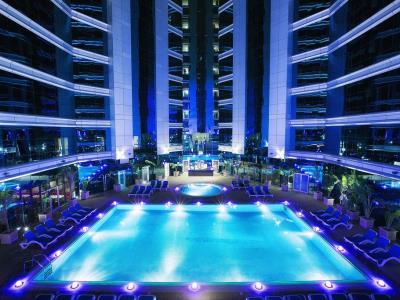 outdoor pool - hotel ghaya grand - dubai, united arab emirates