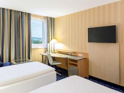 bedroom 1 - hotel nh danube city - vienna, austria