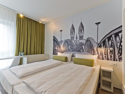 bedroom - hotel super 8 by wyndham freiburg - freiburg im breisgau, germany