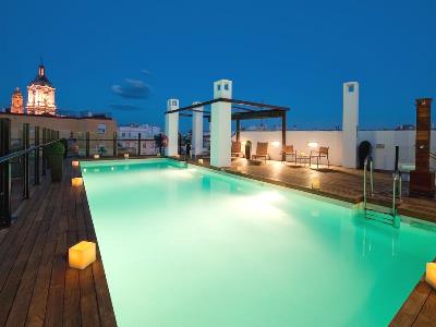 outdoor pool - hotel vincci seleccion posada del patio - malaga, spain
