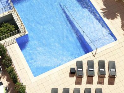 outdoor pool - hotel novotel barcelona sant joan despi - sant joan despi, spain