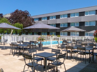 outdoor pool 1 - hotel novotel caen cote de nacre - caen, france