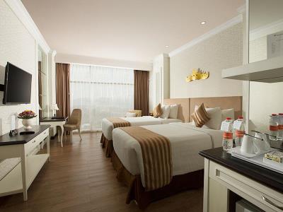 deluxe room 1 - hotel swiss-belhotel lampung - bandar lampung, indonesia