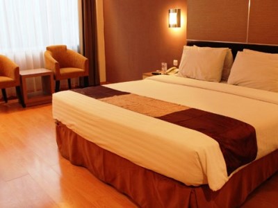 bedroom 1 - hotel grand inna tunjungan - surabaya, indonesia