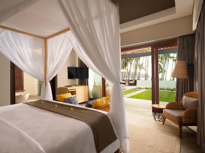 bedroom - hotel the kayana beach lombok - lombok, indonesia