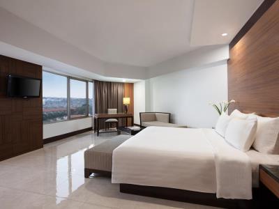 bedroom - hotel hotel santika premiere semarang - semarang, indonesia