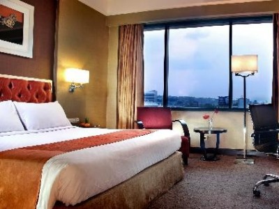 bedroom 2 - hotel ciputra semarang by swiss-belhotel intl - semarang, indonesia