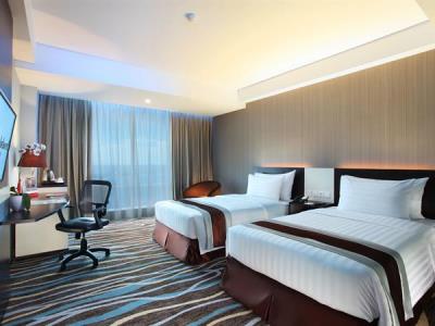 deluxe room 1 - hotel swiss-belhotel makassar - makassar, indonesia