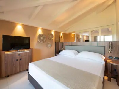 bedroom - hotel baia di chia resort, curio collection - domus de maria, italy