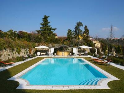 outdoor pool - hotel byblos art villa amista - verona, italy