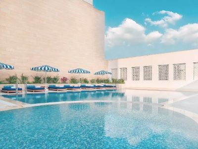 outdoor pool - hotel al najada doha hotel by tivoli - doha, qatar