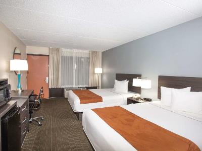 bedroom 2 - hotel days inn and suites orlando airport - orlando, united states of america